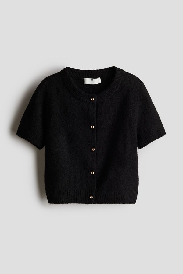 Cardigan de manga corta tejida en punto fino